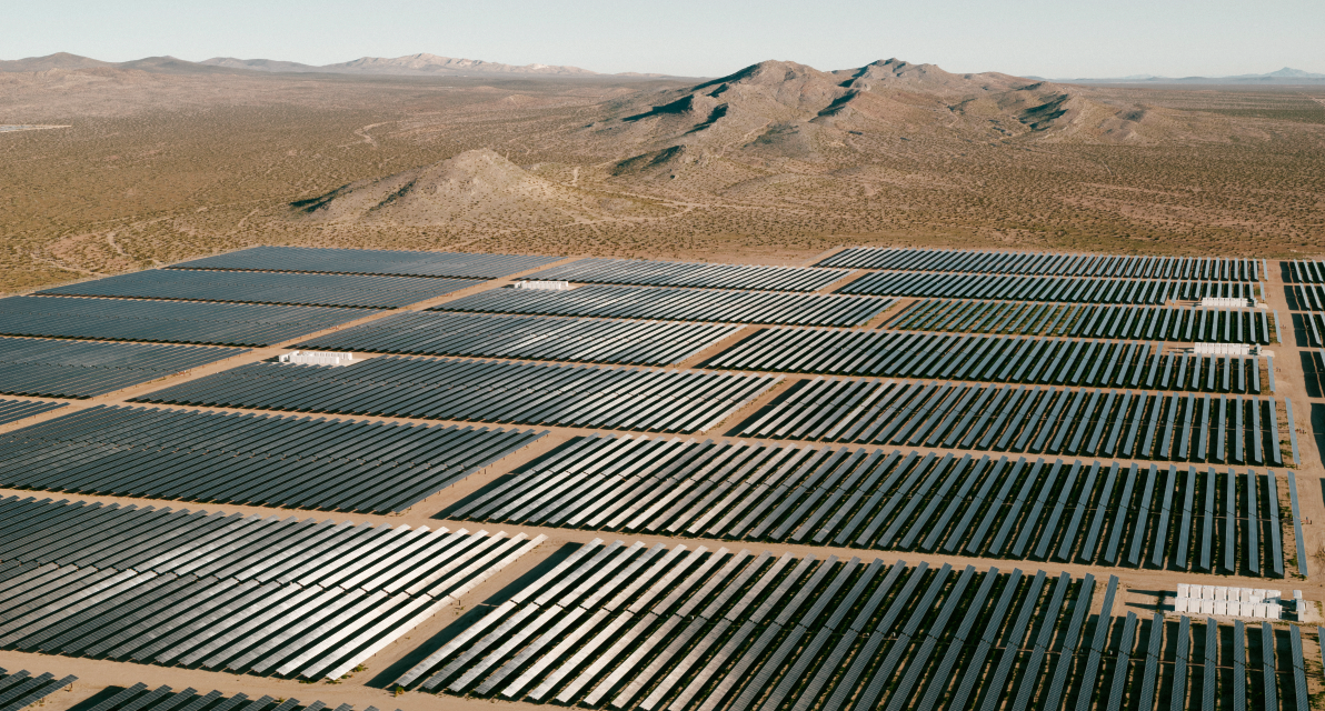 A solar farm in a desert landscape. 