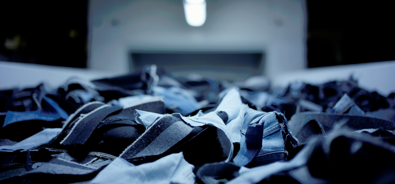 Pieces of blue fabric scattered on the ground. 